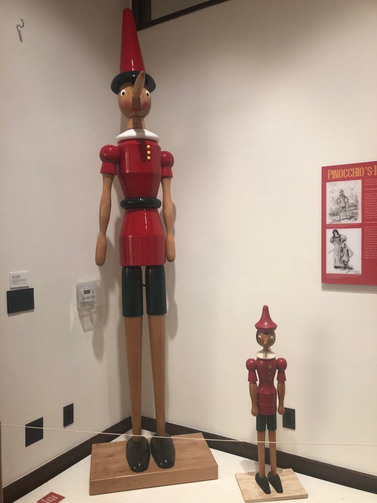 Wooden statues of Pinocchio made in Italy by Mastro Gepetto SNC at "A Real Boy" at Italian American Museum of Los Angeles