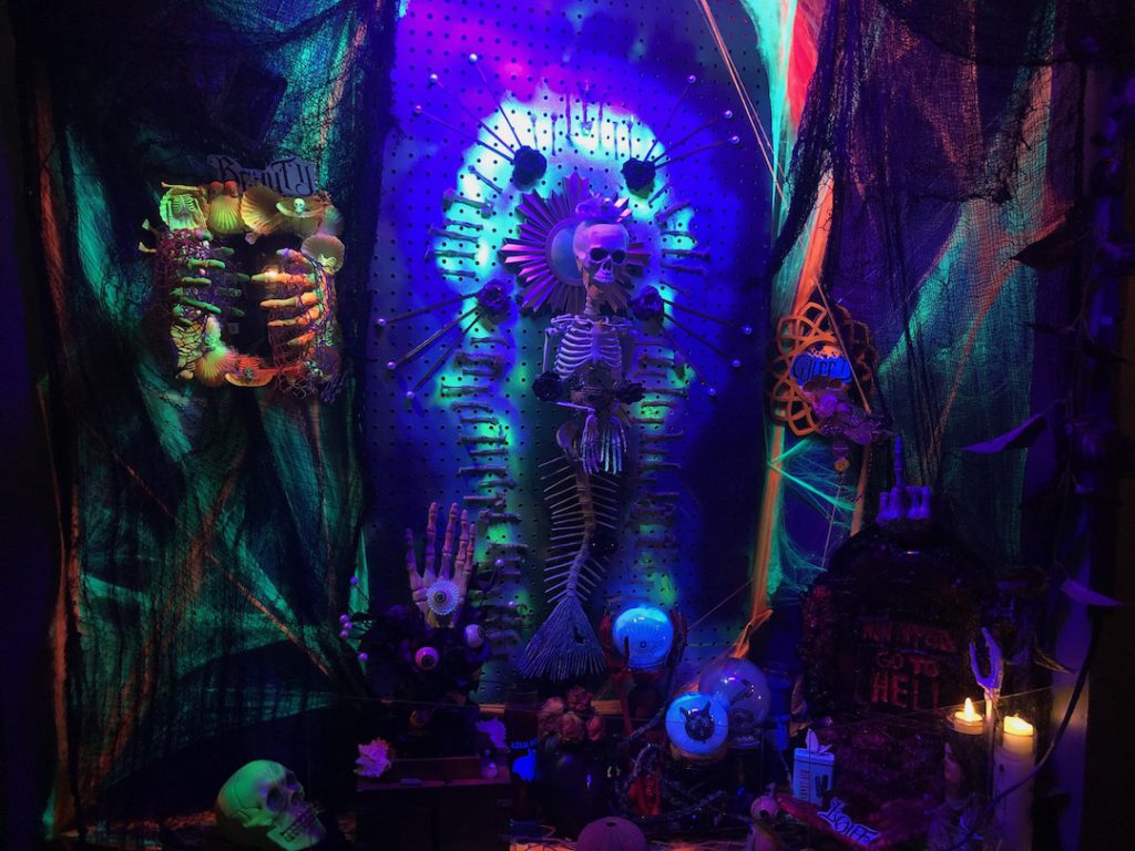 The Mermaid Little Tokyo Los Angeles Halloween 2023 altar with a mermaid skeleton in the center surrounded by spooky odds and ends. (Photo: Liz Ohanesian)