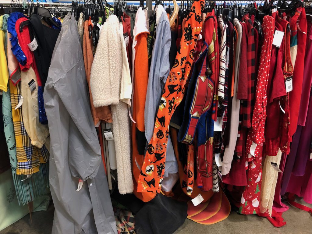 A Halloween costume and seasonal clothing rack at Goodwill Glassell Park with Halloween pajama bottoms and Christmas pajama bottoms (Photo:Liz Ohanesian)