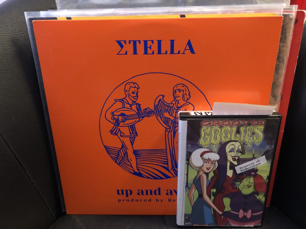 Stack of records with ?tella Up and Away visible in front and DVD box set of Groovie Goolies with Videotheque sticker. (Photo: Liz Ohanesian)