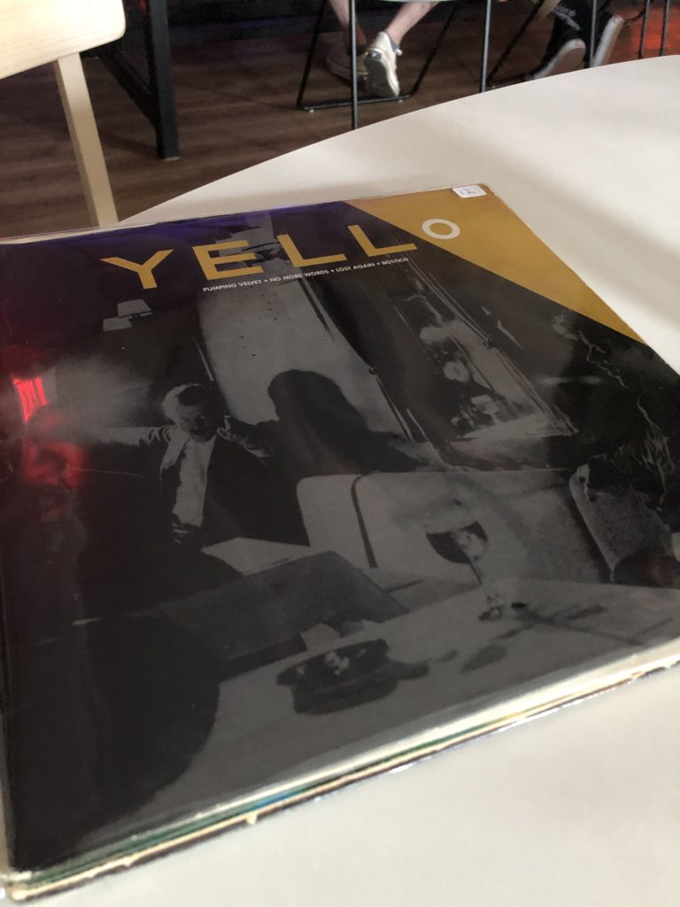 Yello 12" vinyl with "Lost Again" and "Bostich" photographed inside Homage Brewing by Liz Ohanesian