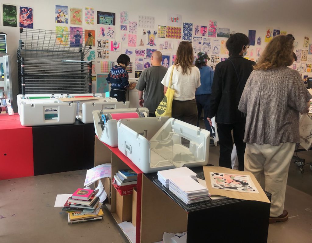 People standing in line to use a risograph printer at ArtCenter During Printed Matter L.A. Art Book Fair on Sunday, May 18, 2025 (Photo: Liz Ohanesian)