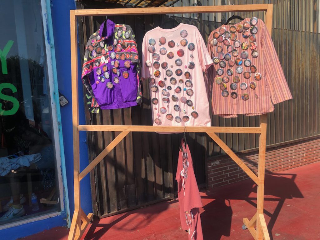 buttons on jackets and t-shirts hanging outside of Leiminspace in Chinatown for opening Monday Nights: L.A.'s Scene of the Century (Photo: Liz Ohanesian)