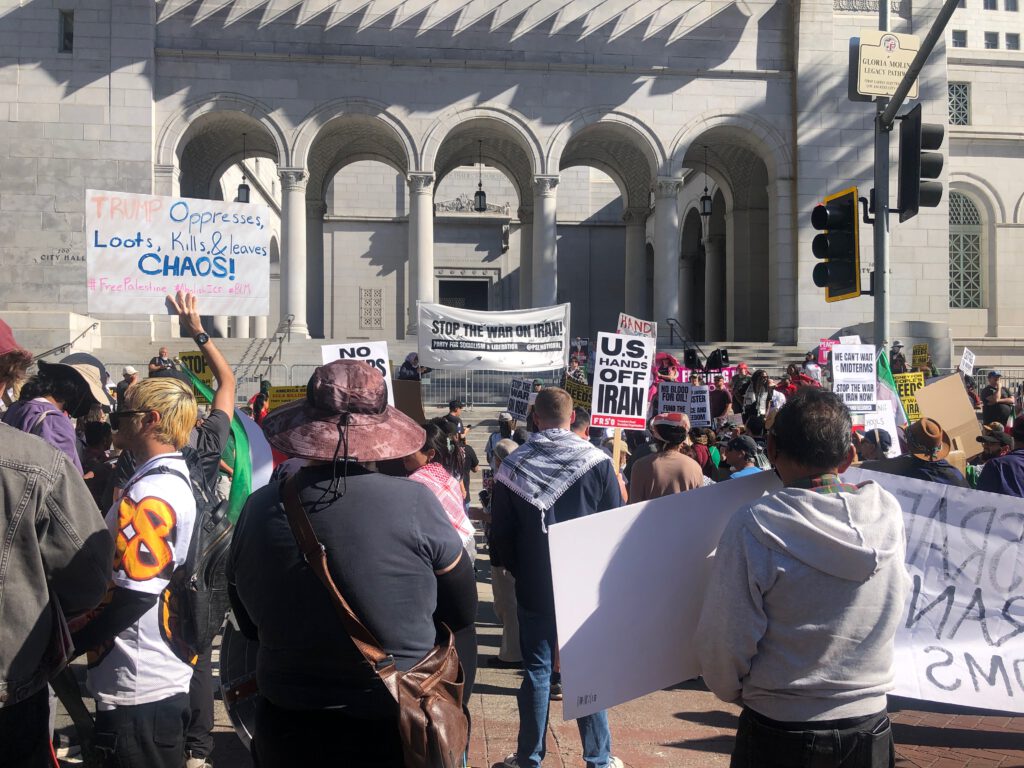 Photo of antiwar protestors in front of Los Angeles City Hall on March 7, 2026 (Photo: Liz Ohanesian)