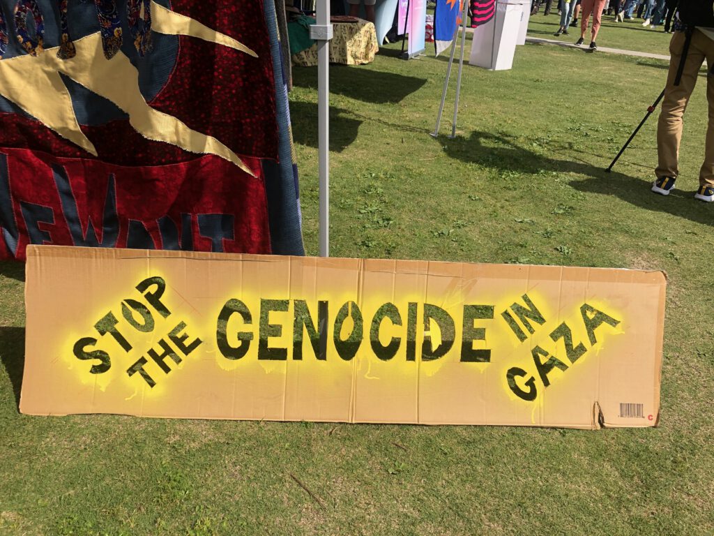 A sign that reads "Stop the genocide in Gaza" at No Kings protest in downtown Los Angeles on March 28, 2026 (Photo: Liz Ohanesian)