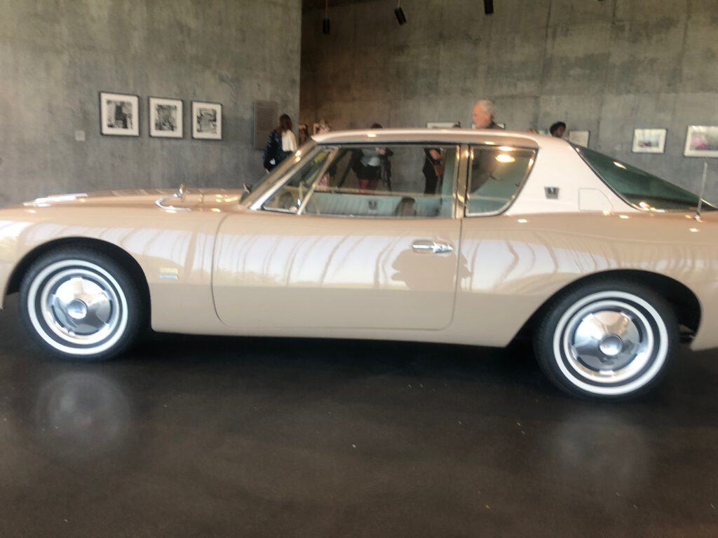1963 Studebaker with Ed Ruscha photos in the background at David Geffen Galleries at LACMA (Photo: Liz Ohanesian)
