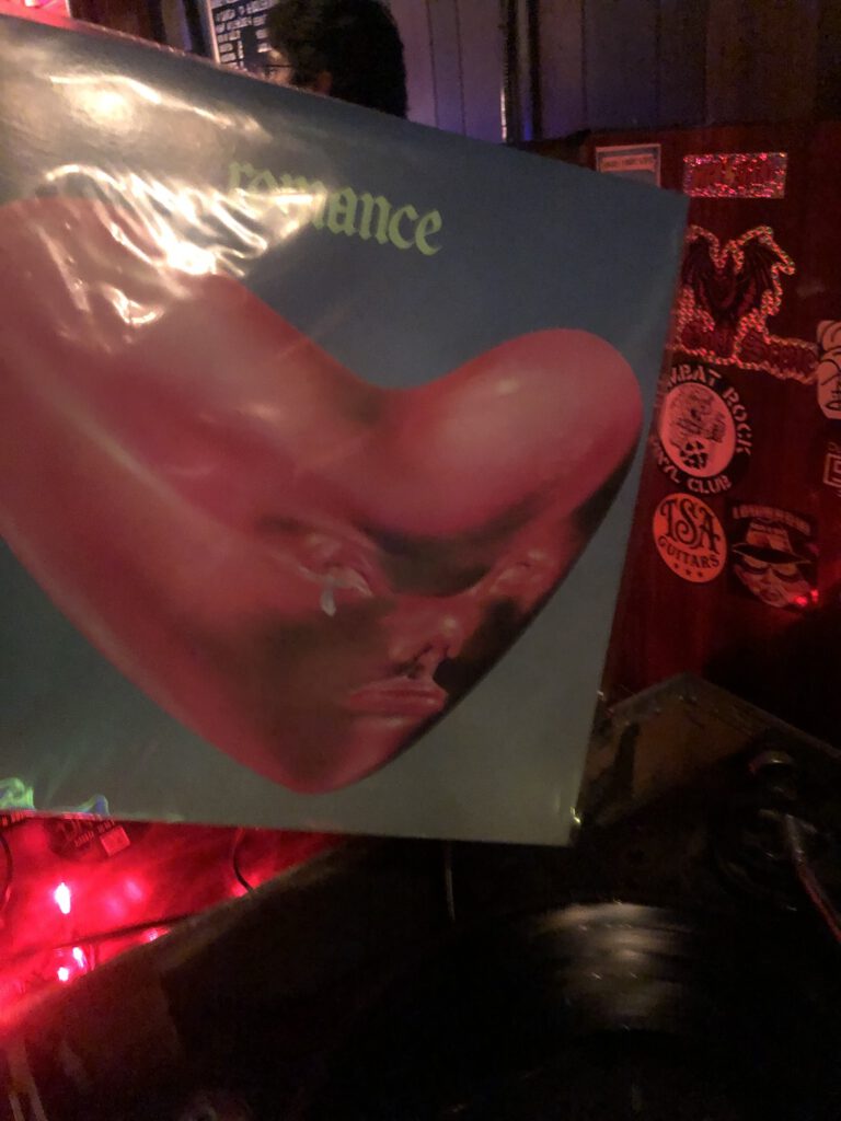 Fontaines D.C. Romance on vinyl in DJ booth at Footsies in Los Angeles (Photo: Liz Ohanesian)