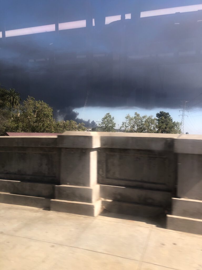 bus view of smoke from Lineage Logistics fire 6/17/26 (Photo: Liz Ohanesian)